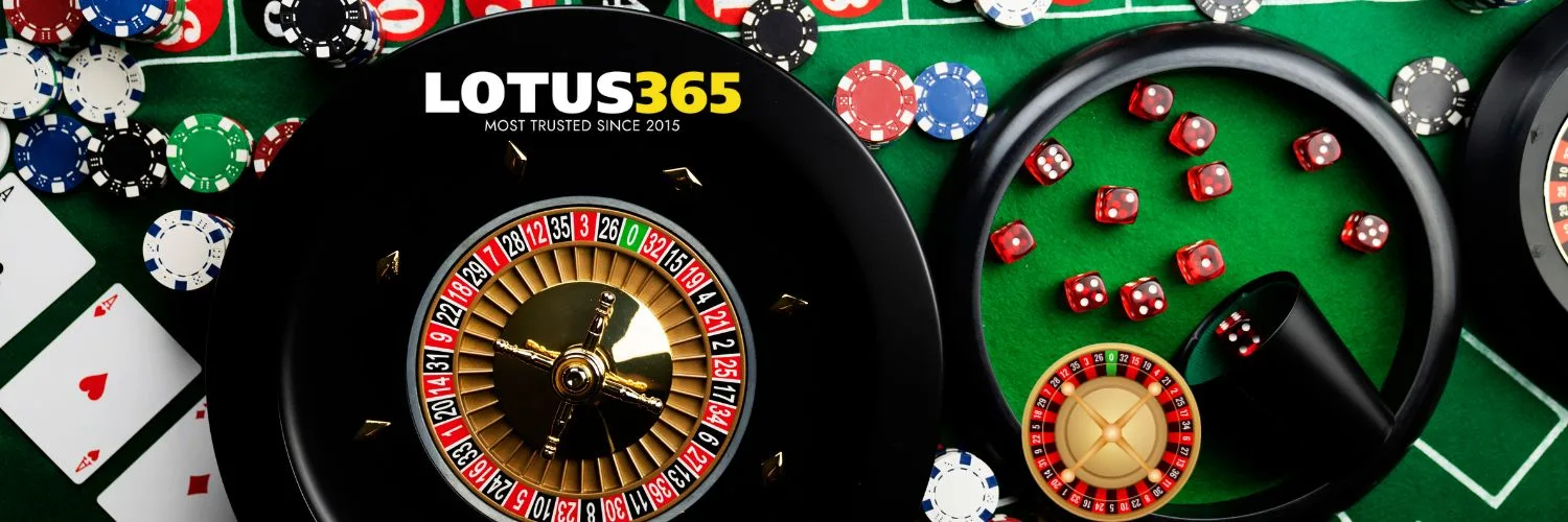 Roulette wheel with playing cards, coins, and dice on table representing live casino games on Lotus365