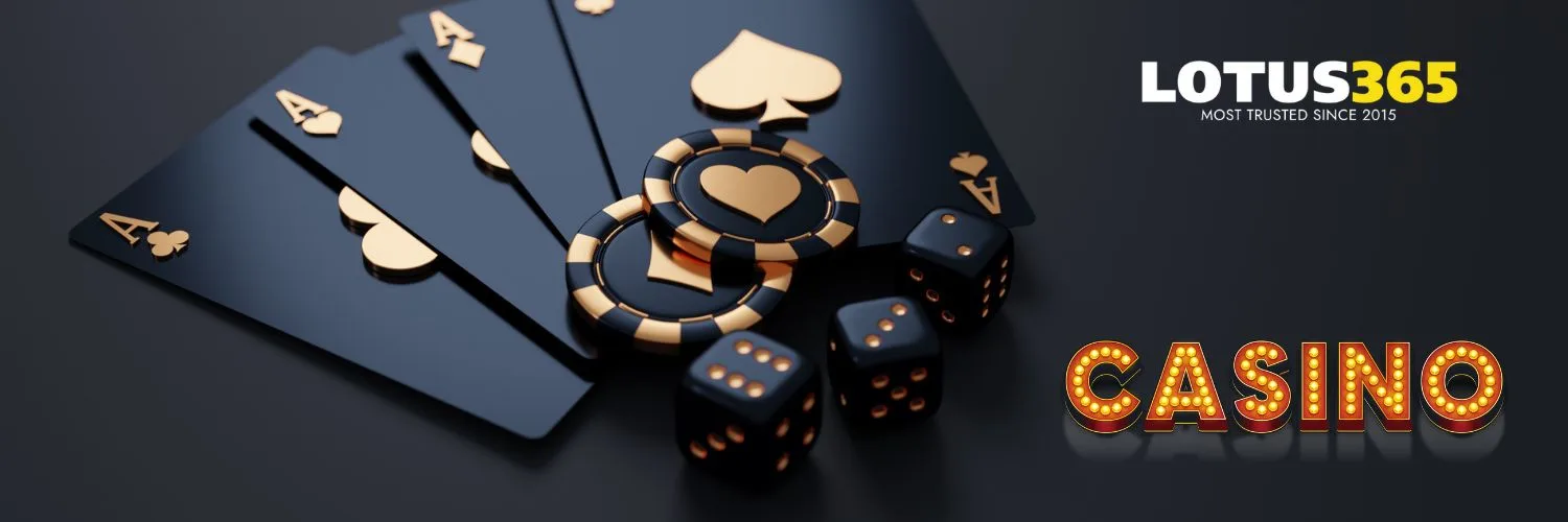 Black and gold playing cards with matching coins and dice representing premium casino gaming on Lotus365