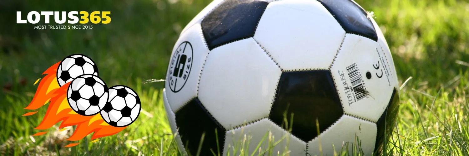 Soccer ball on the ground representing football betting on Lotus365